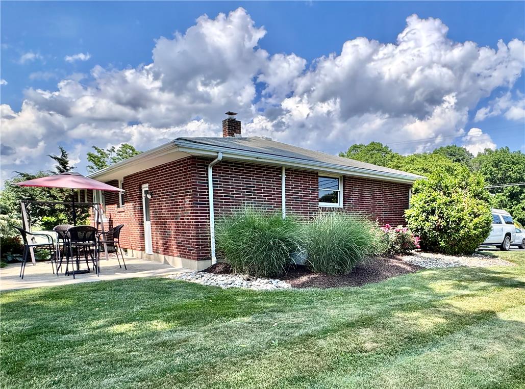5334 Egypt Road Laurys Station, PA 18059 - Photo 49 of 55 A well-maintained red brick ranch home awaits with a comfortable outdoor patio for relaxation.