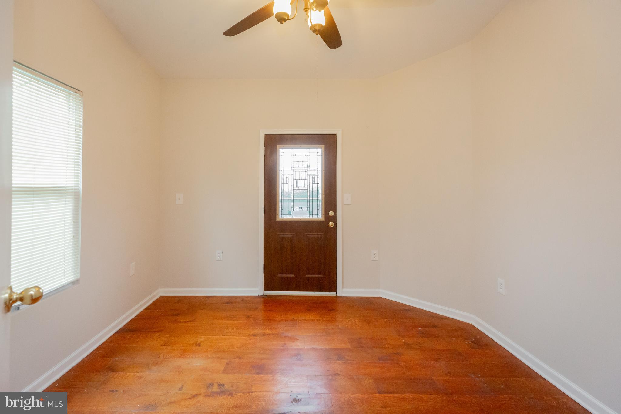 2129 Channing Street Northeast Washington, DC 20018 - Photo 13 of 37 an empty room with ceiling fan and window