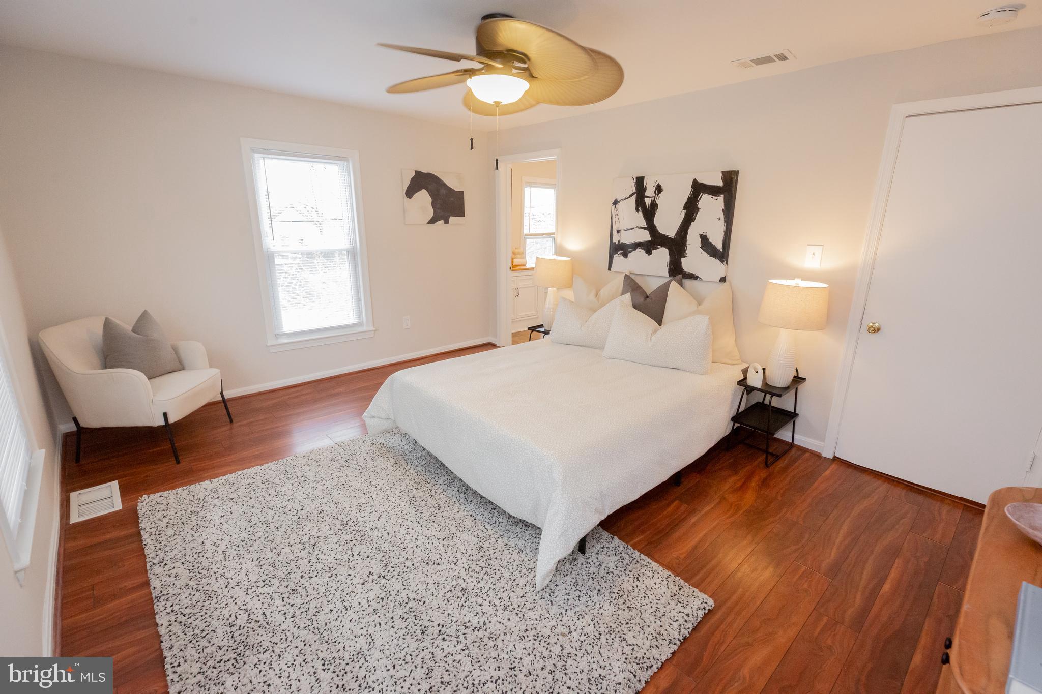 2129 Channing Street Northeast Washington, DC 20018 - Photo 17 of 37 a bedroom with a bed chandelier couch and a window