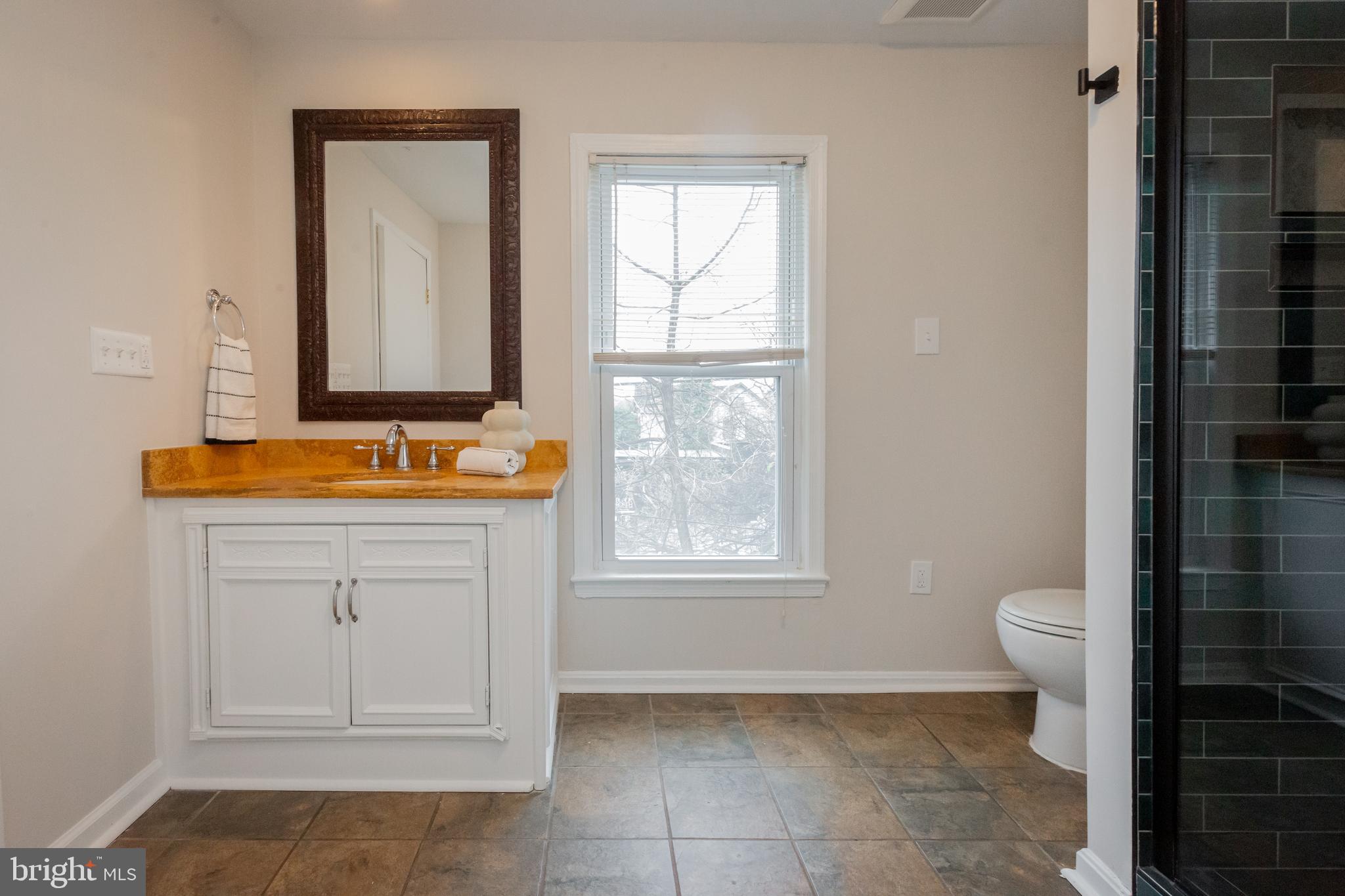2129 Channing Street Northeast Washington, DC 20018 - Photo 22 of 37 a bathroom with a toilet sink and a shower