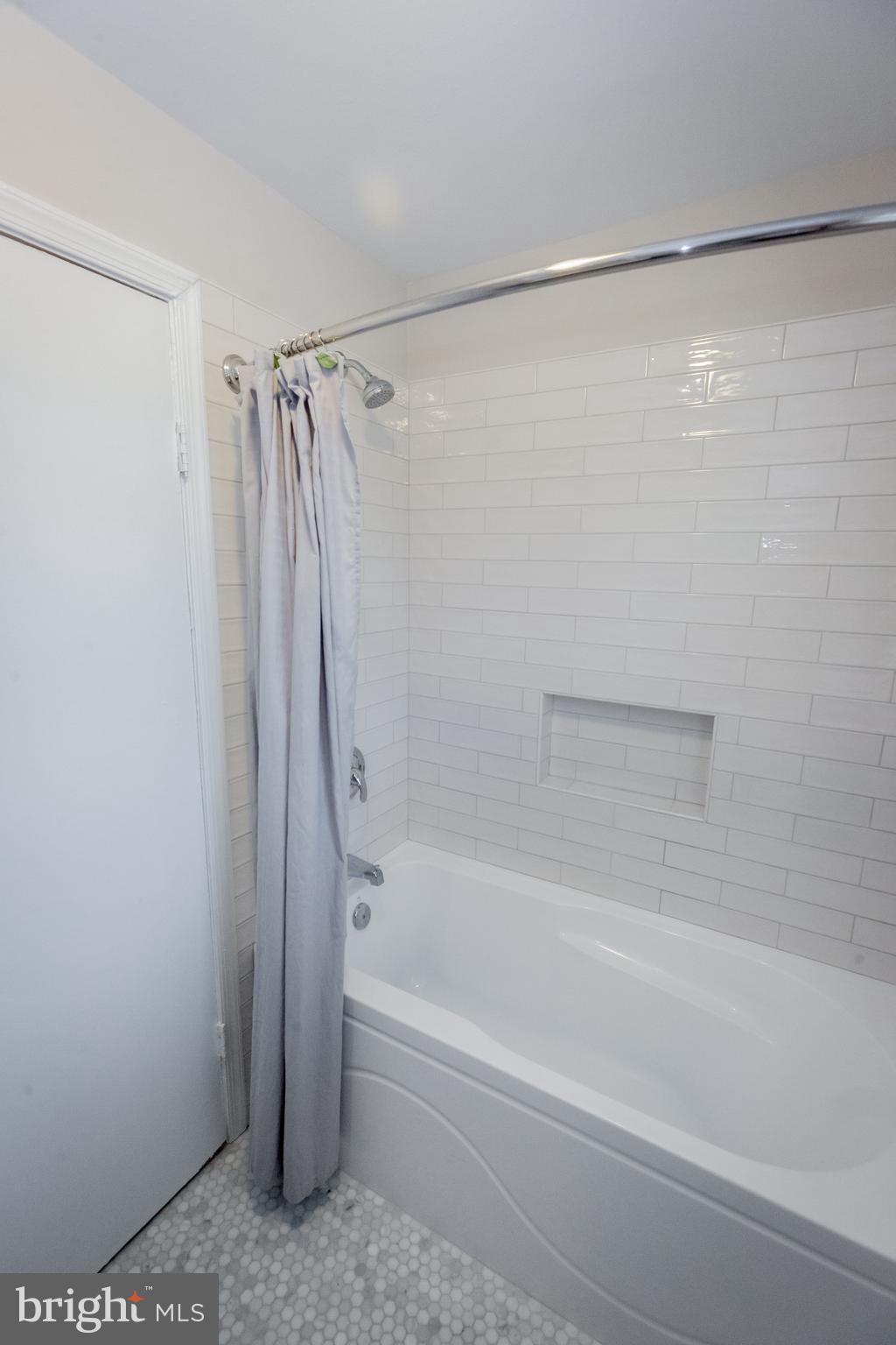 2129 Channing Street Northeast Washington, DC 20018 - Photo 27 of 37 a bathroom with a shower and a bath tub