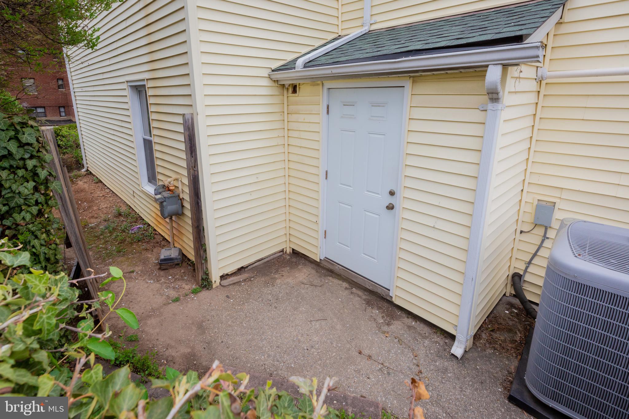 2129 Channing Street Northeast Washington, DC 20018 - Photo 34 of 37 a view of a house with a yard and garage