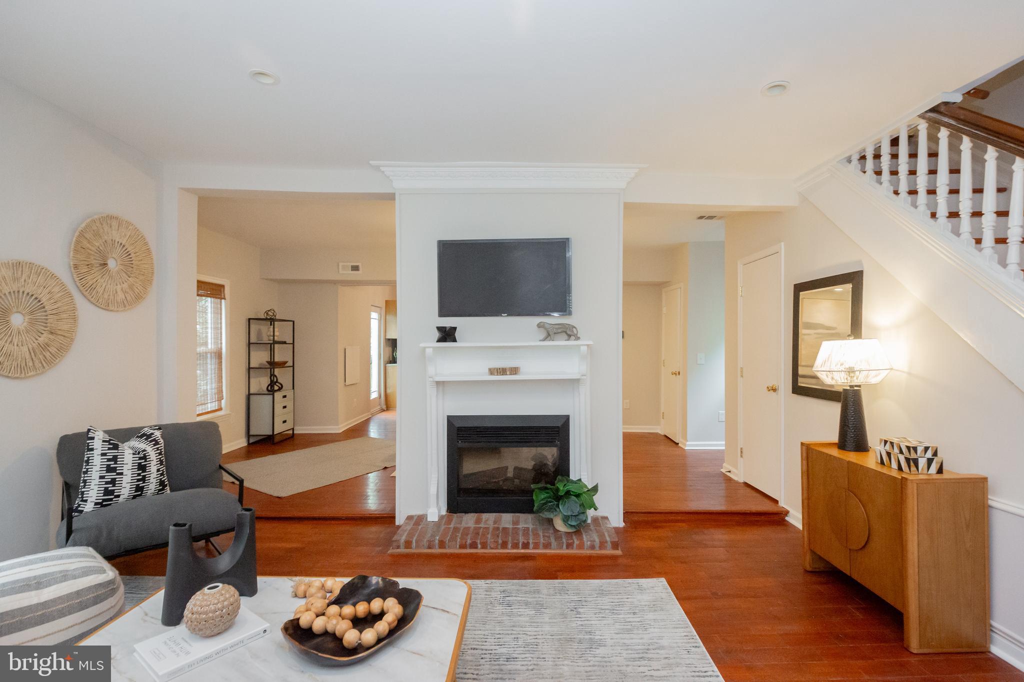 2129 Channing Street Northeast Washington, DC 20018 - Photo 6 of 37 a living room with furniture a fireplace and a flat screen tv