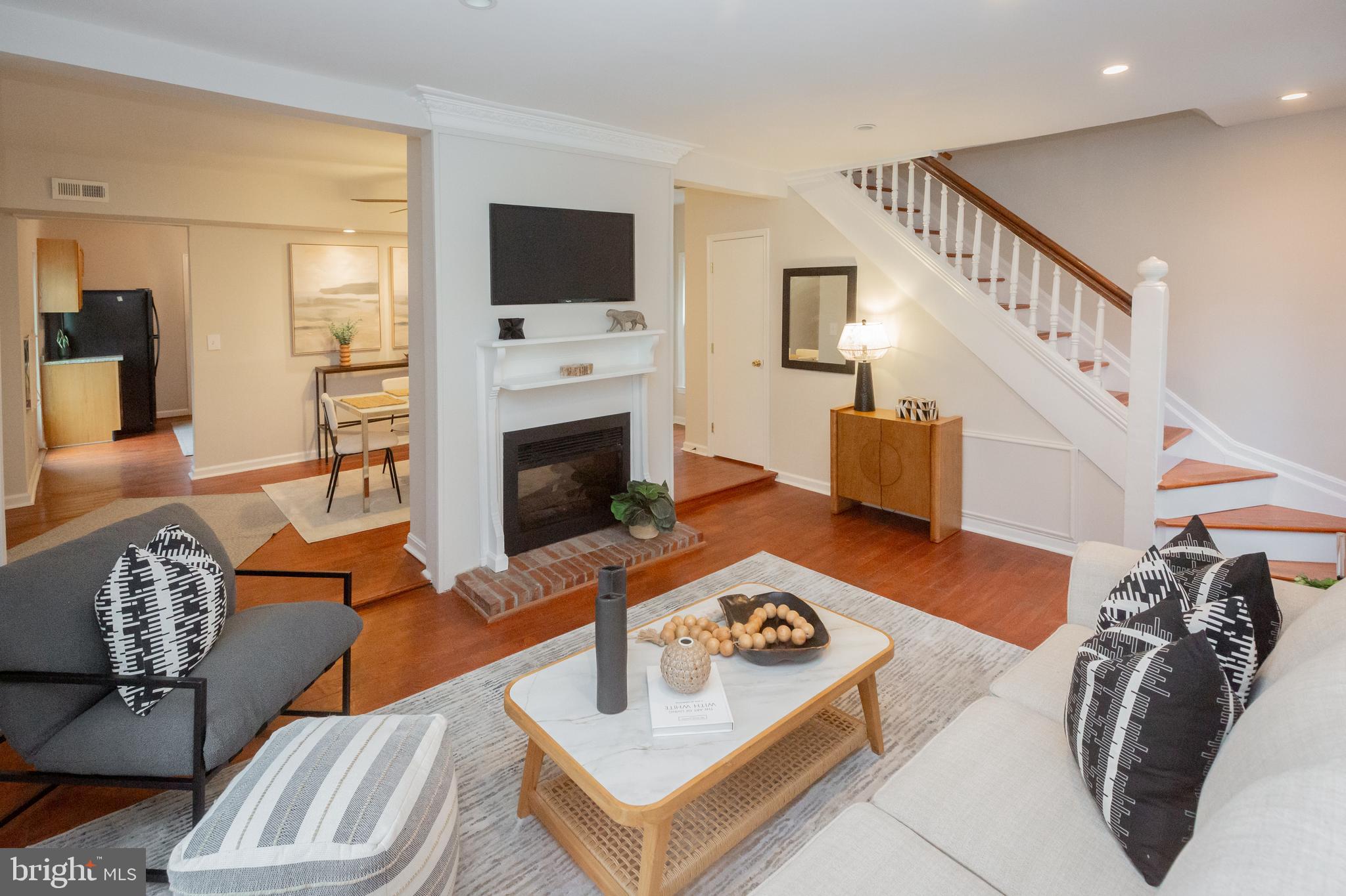 2129 Channing Street Northeast Washington, DC 20018 - Photo 7 of 37 a living room with furniture and a fireplace