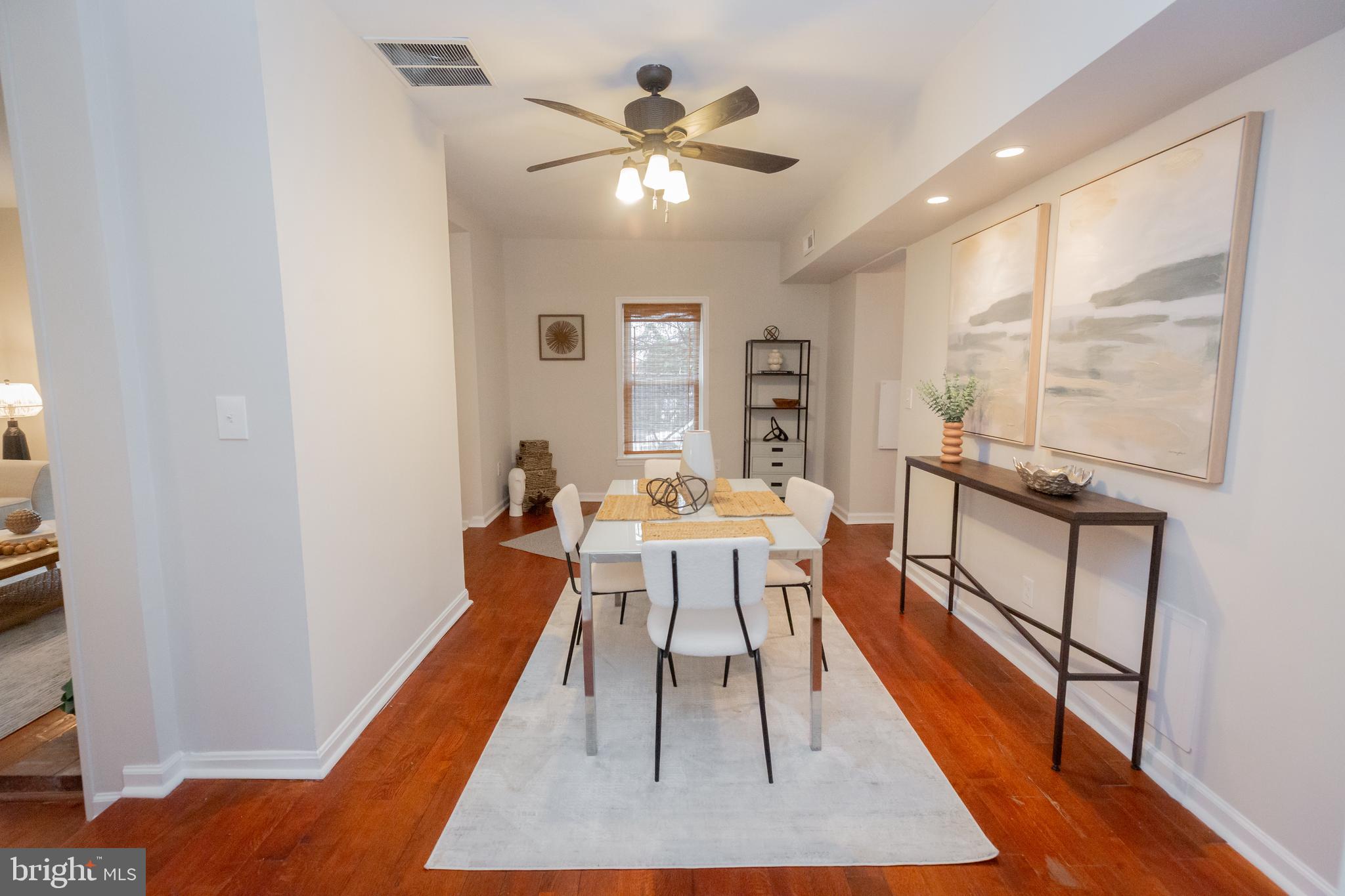 2129 Channing Street Northeast Washington, DC 20018 - Photo 10 of 37 a dining room with wooden floor and a rug