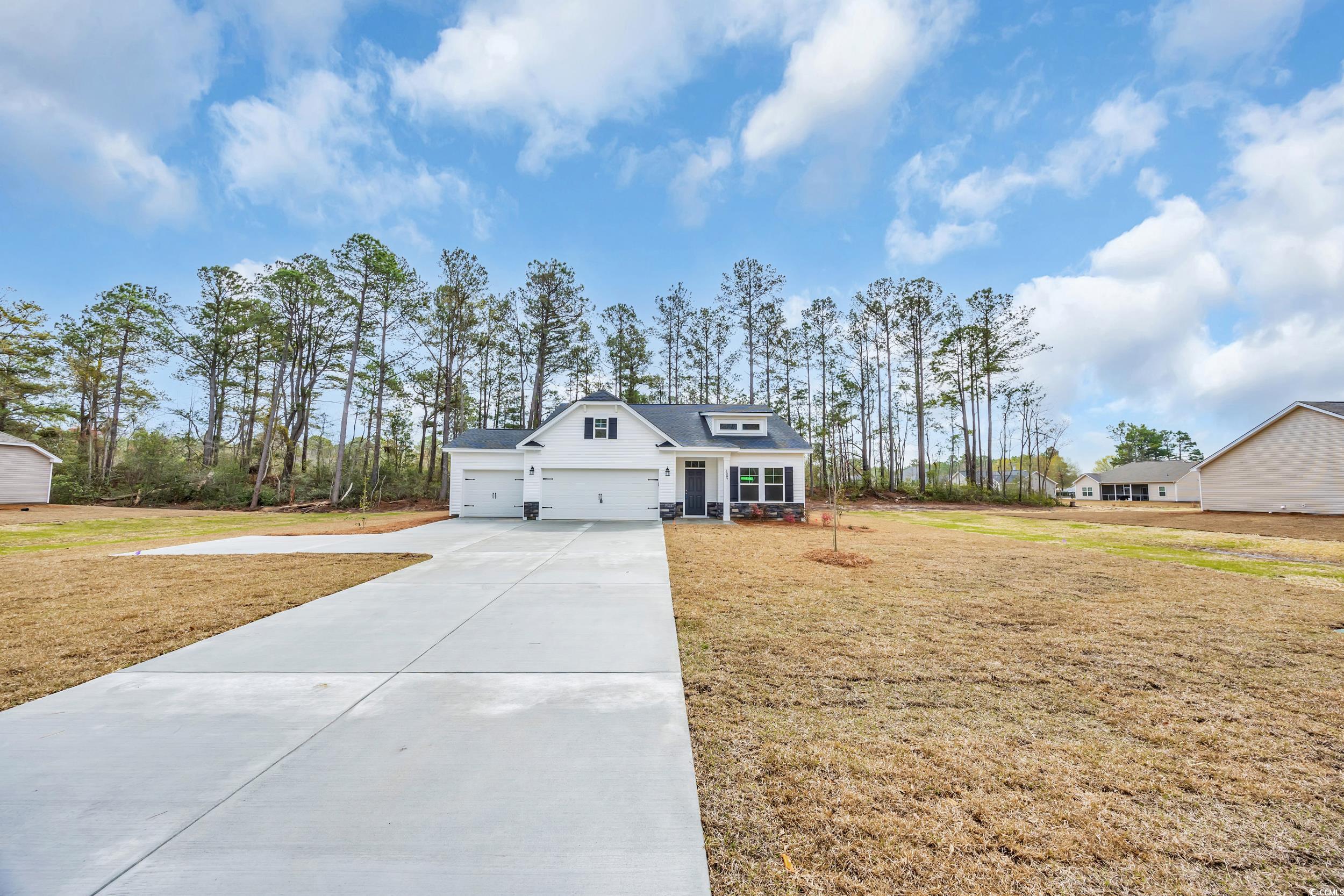 1587 Highway 701 South Loris Sc 29569 Loris, SC 29569 - Photo 1 of 37 View of front facade with a front lawn, a garage,