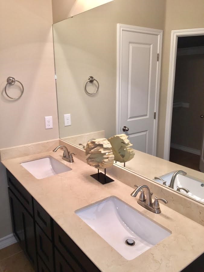 6303 Ramin Court Laredo, TX 78041 - Photo 19 of 20 a bathroom with a sink and a mirror