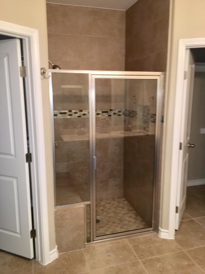 6303 Ramin Court Laredo, TX 78041 - Photo 20 of 20 a bathroom with a glass shower door