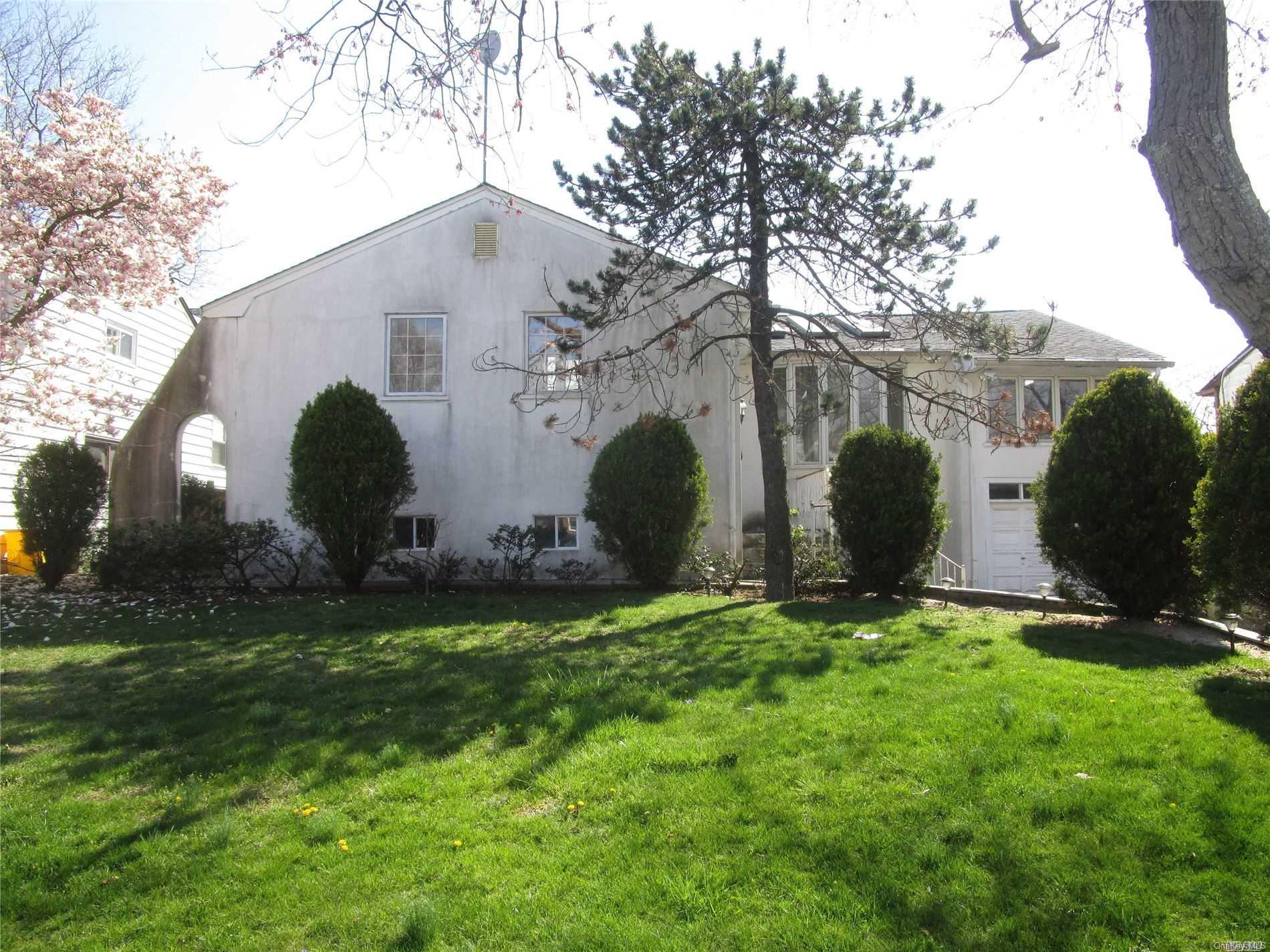 61 Flower Road Valley Stream, NY 11581 - Photo 1 of 1 a view of a back yard