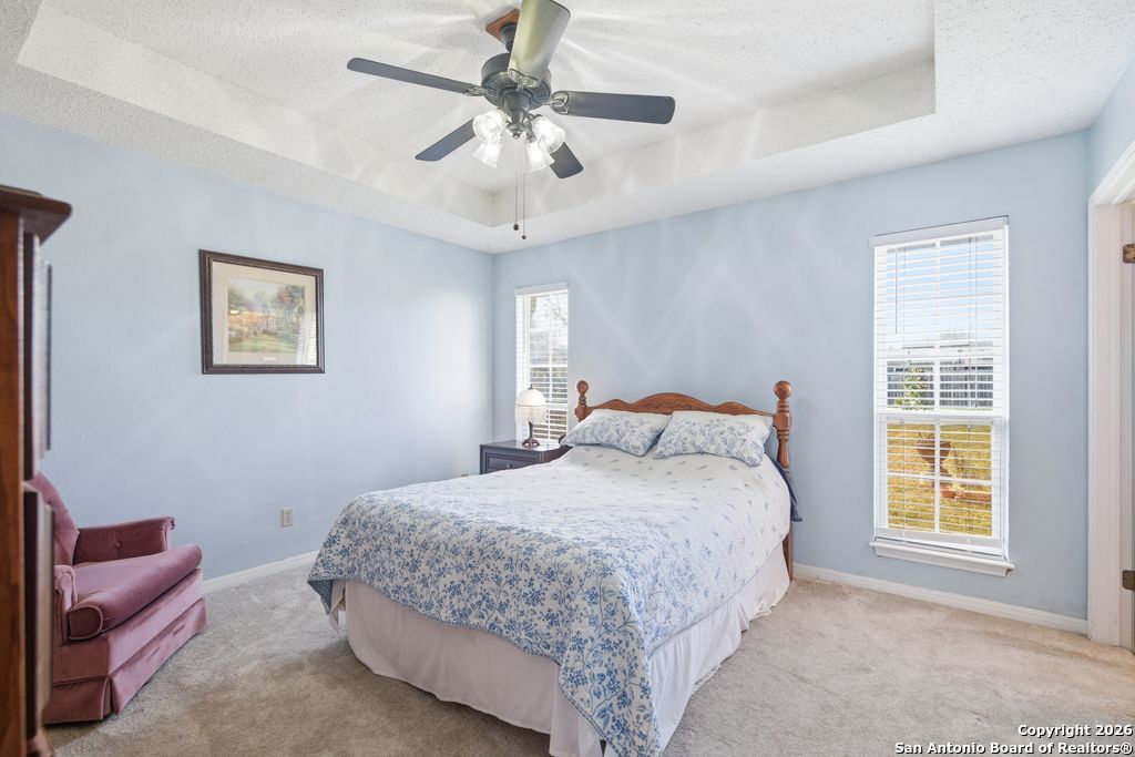 1909 Killarney Drive Leander, TX 78641 - Photo 15 of 29 a bedroom with a large bed and a window