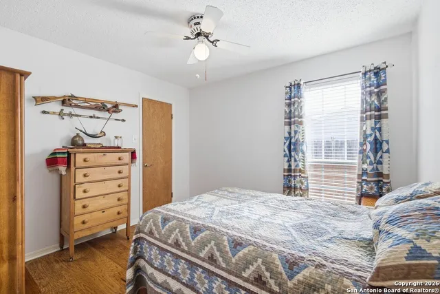 a bedroom with a bed and a tv