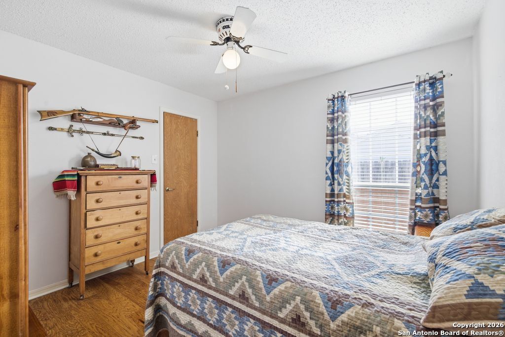 1909 Killarney Drive Leander, TX 78641 - Photo 19 of 29 a bedroom with a bed and a tv