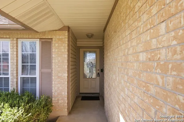 a view of a brick house with a glass door