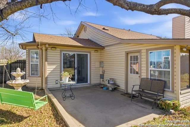 a front view of a house with outdoor seating