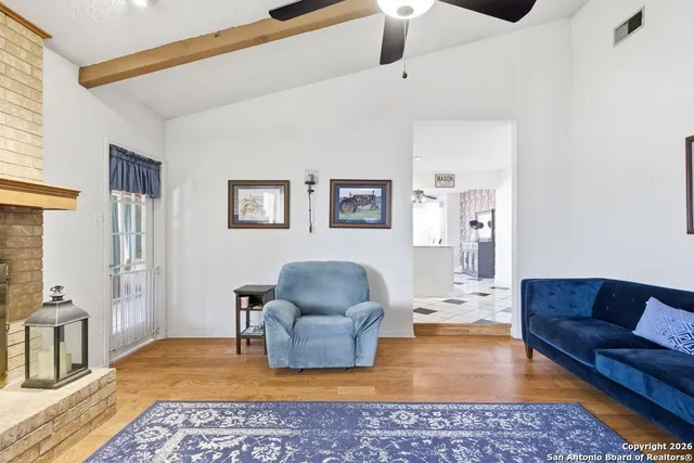 a living room with furniture and a rug