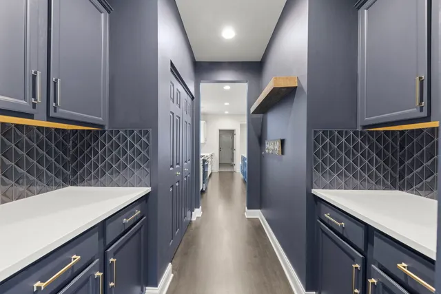 a kitchen with a sink and cabinets