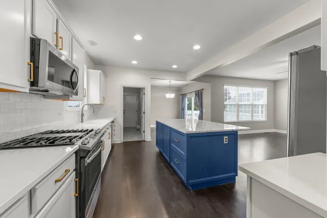 a kitchen with wooden cabinets and a stove top oven