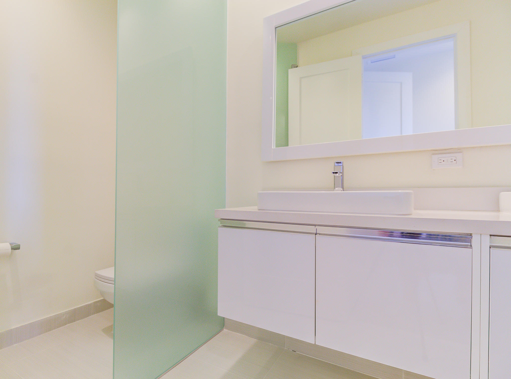 6415 Northwest 102nd Path, Unit 201 Doral, FL 33178 - Photo 11 of 41 a bathroom with a sink and a mirror