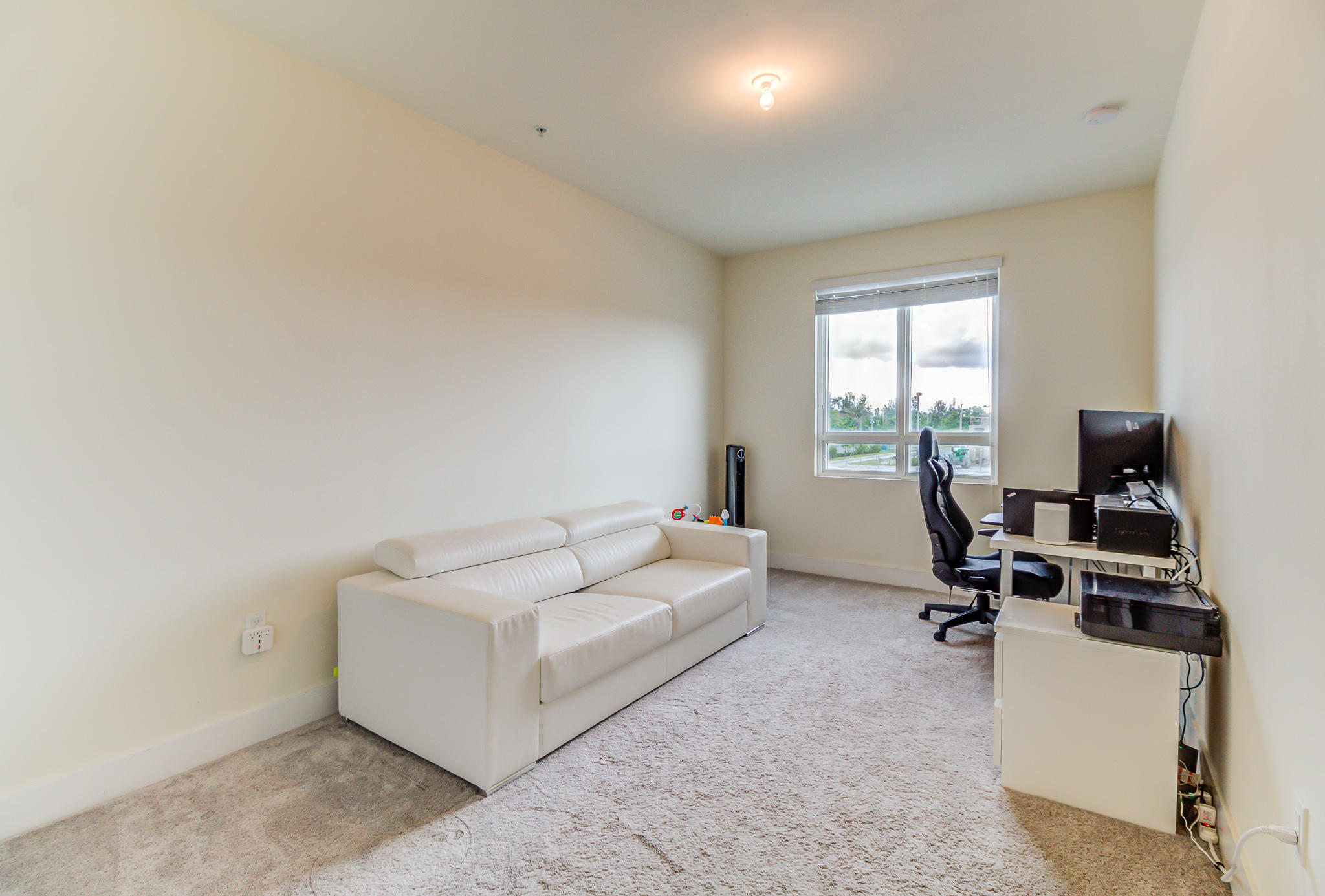 6415 Northwest 102nd Path, Unit 201 Doral, FL 33178 - Photo 13 of 41 a living room with furniture and a window