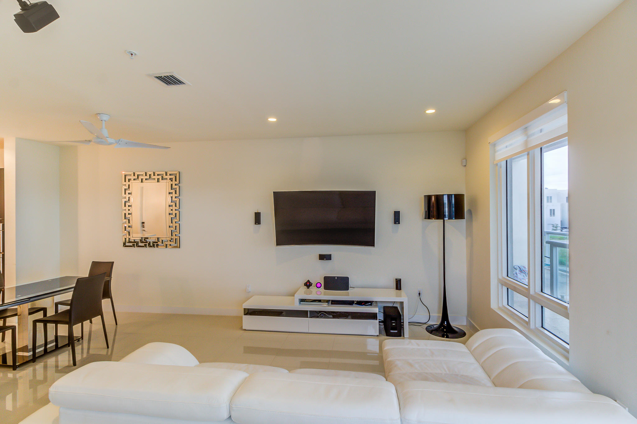 6415 Northwest 102nd Path, Unit 201 Doral, FL 33178 - Photo 17 of 41 a living room with furniture and a flat screen tv