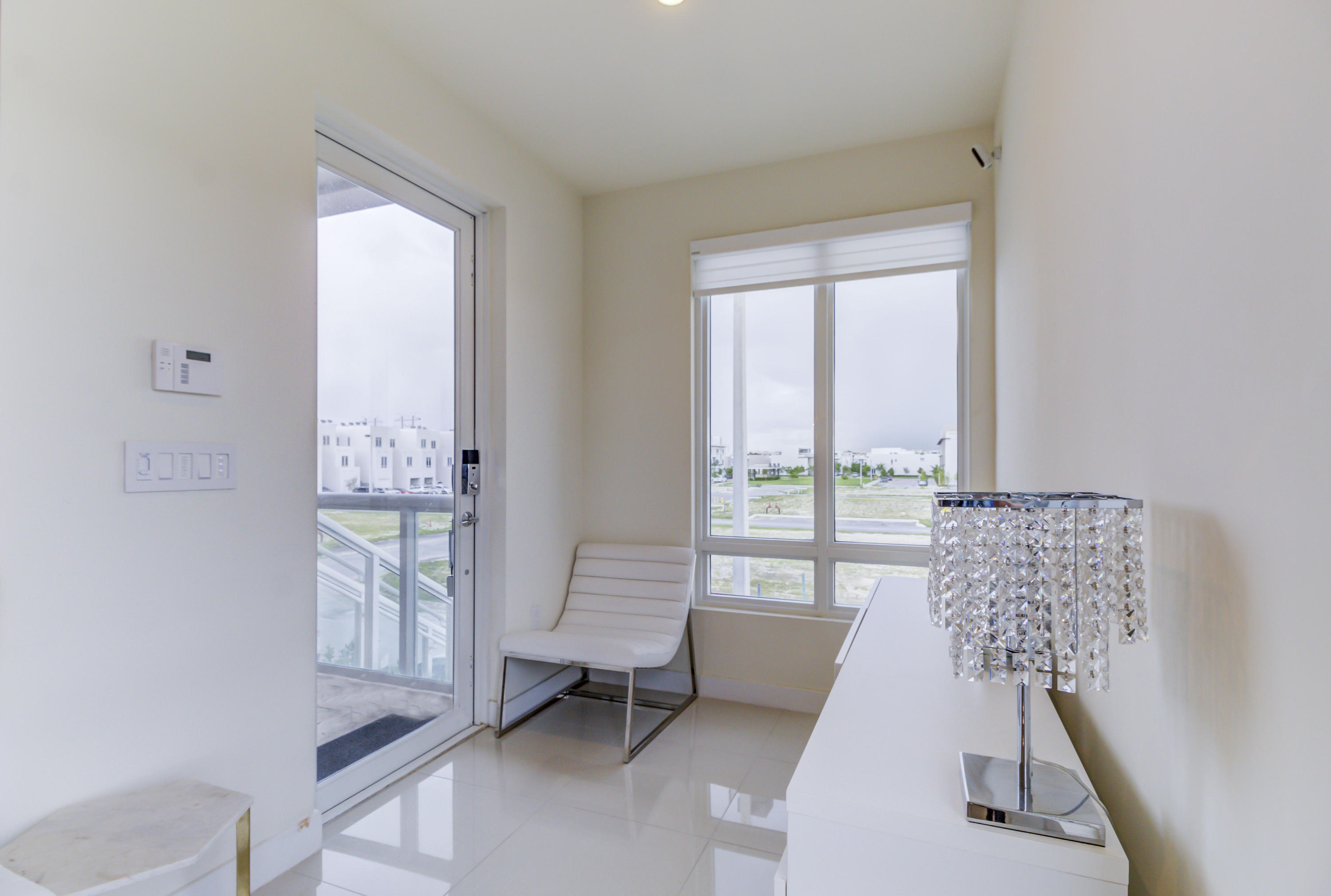 6415 Northwest 102nd Path, Unit 201 Doral, FL 33178 - Photo 20 of 41 a living room with furniture and a window