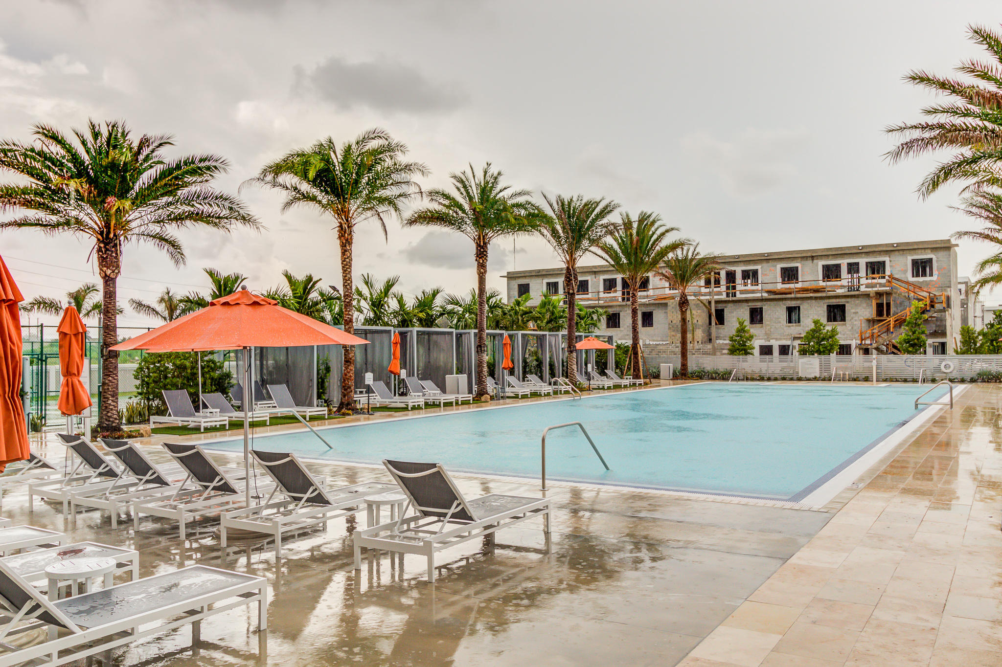 6415 Northwest 102nd Path, Unit 201 Doral, FL 33178 - Photo 24 of 41 a view of swimming pool with outdoor seating and plants