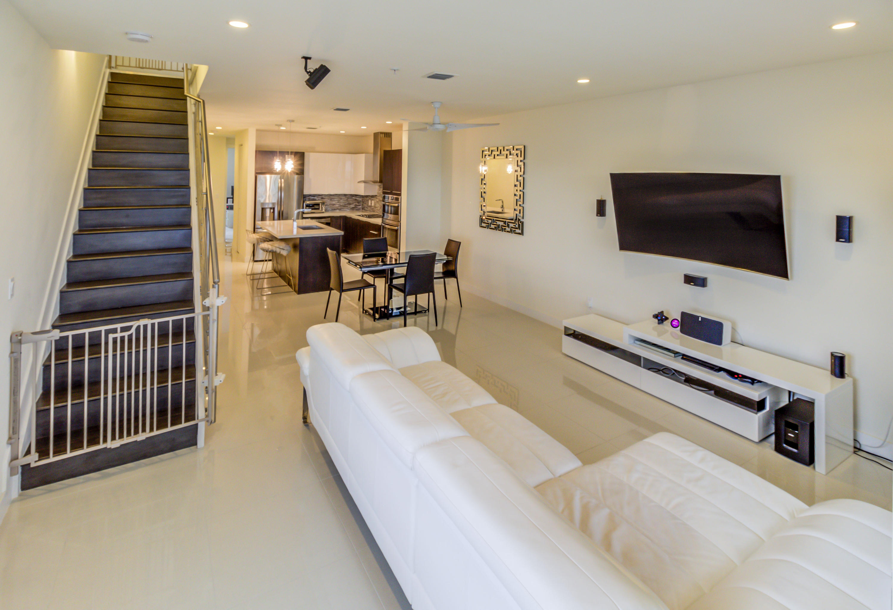 6415 Northwest 102nd Path, Unit 201 Doral, FL 33178 - Photo 3 of 41 a living room with furniture and a flat screen tv
