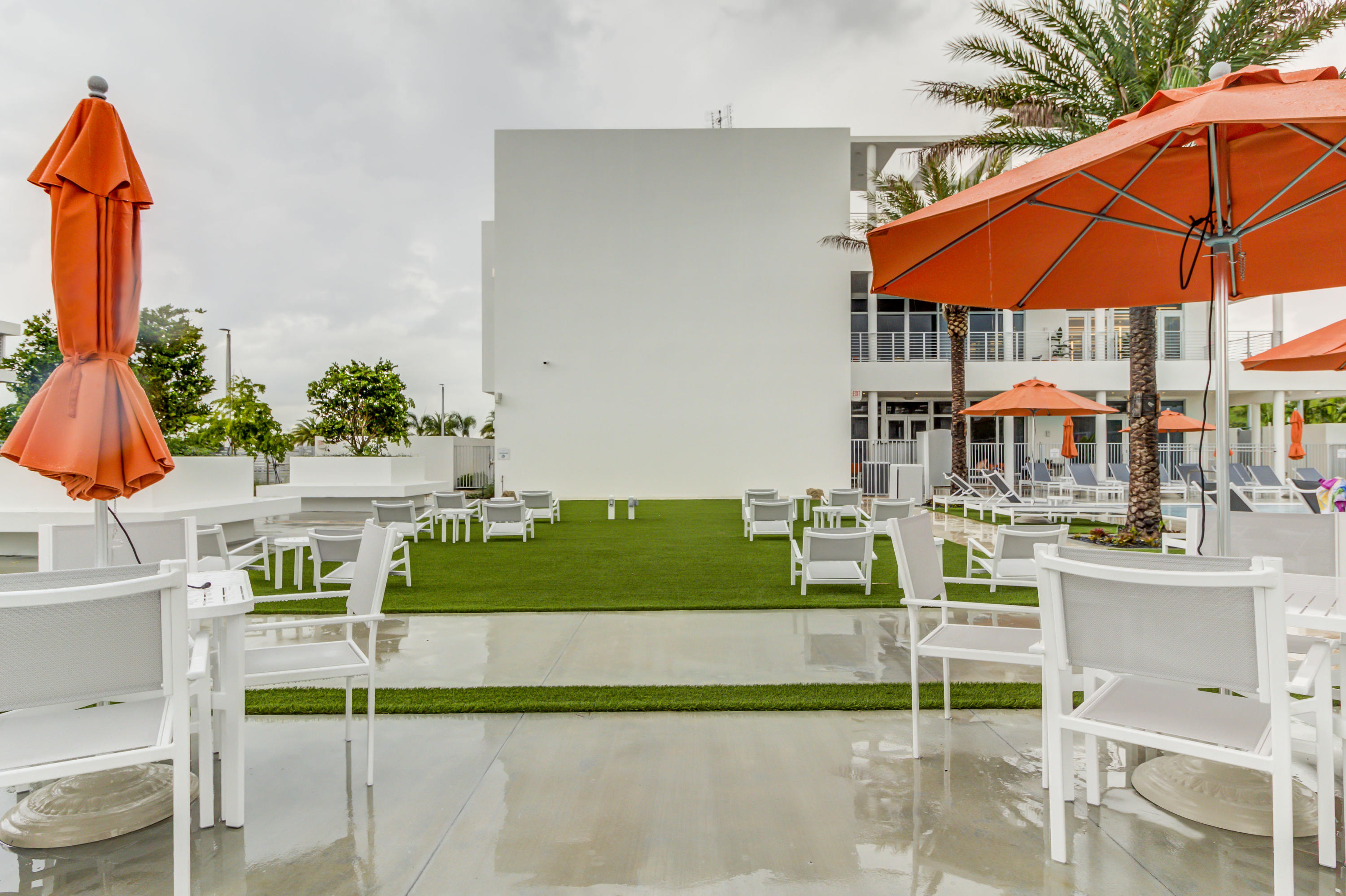 6415 Northwest 102nd Path, Unit 201 Doral, FL 33178 - Photo 36 of 41 a table and chairs in the patio
