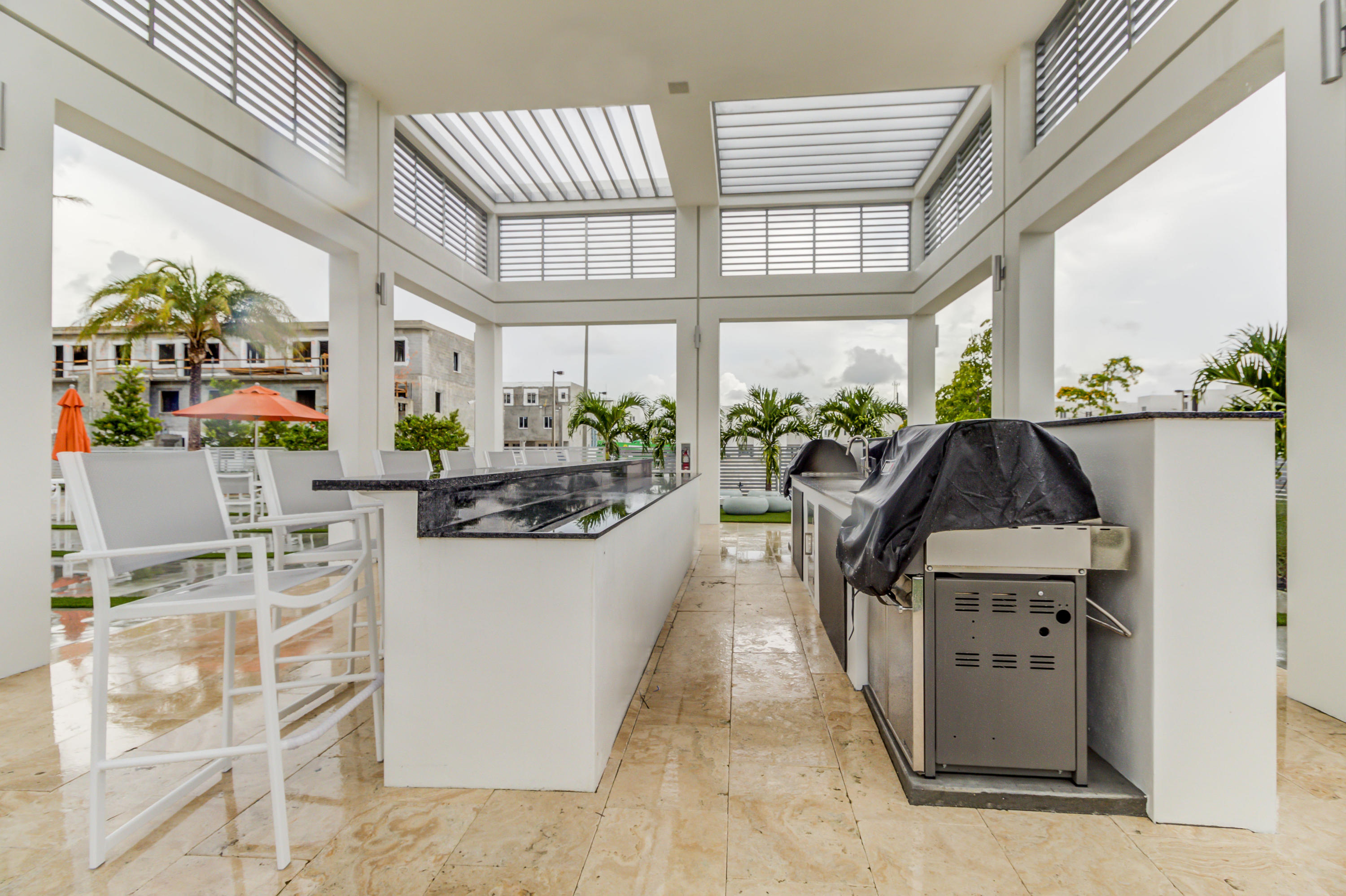 6415 Northwest 102nd Path, Unit 201 Doral, FL 33178 - Photo 37 of 41 a kitchen with a sink appliances and cabinets