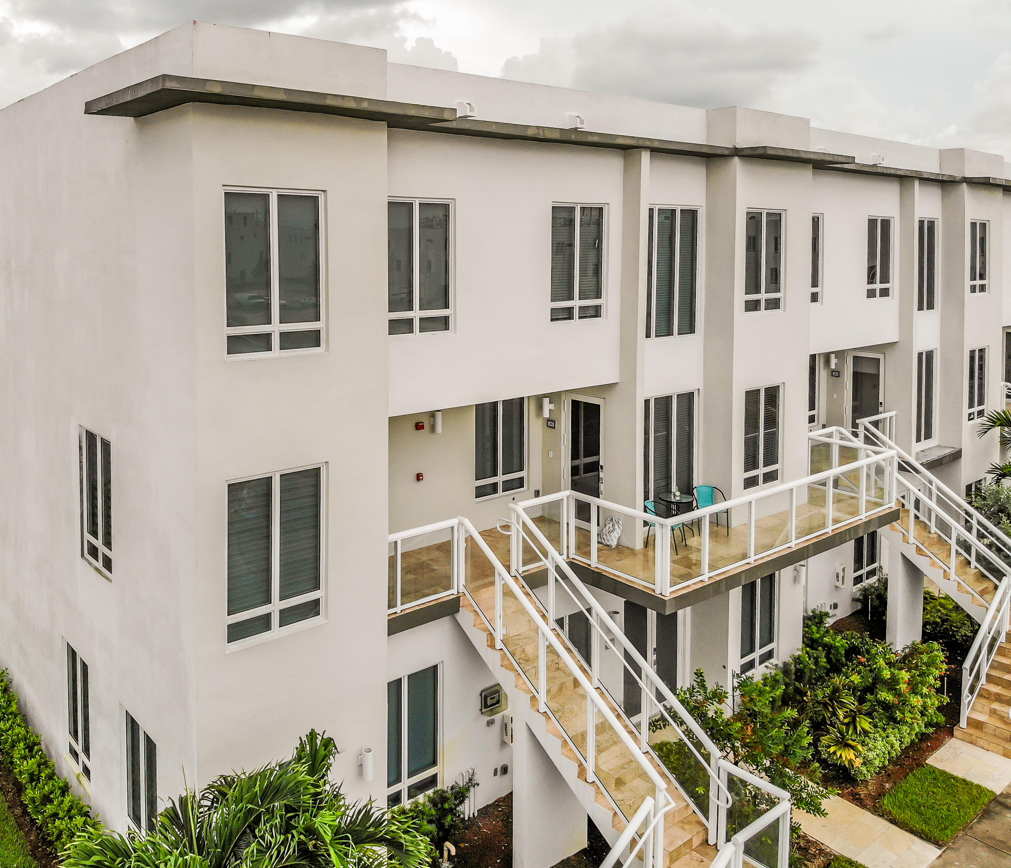 6415 Northwest 102nd Path, Unit 201 Doral, FL 33178 - Photo 39 of 41 a large white building with a large windows