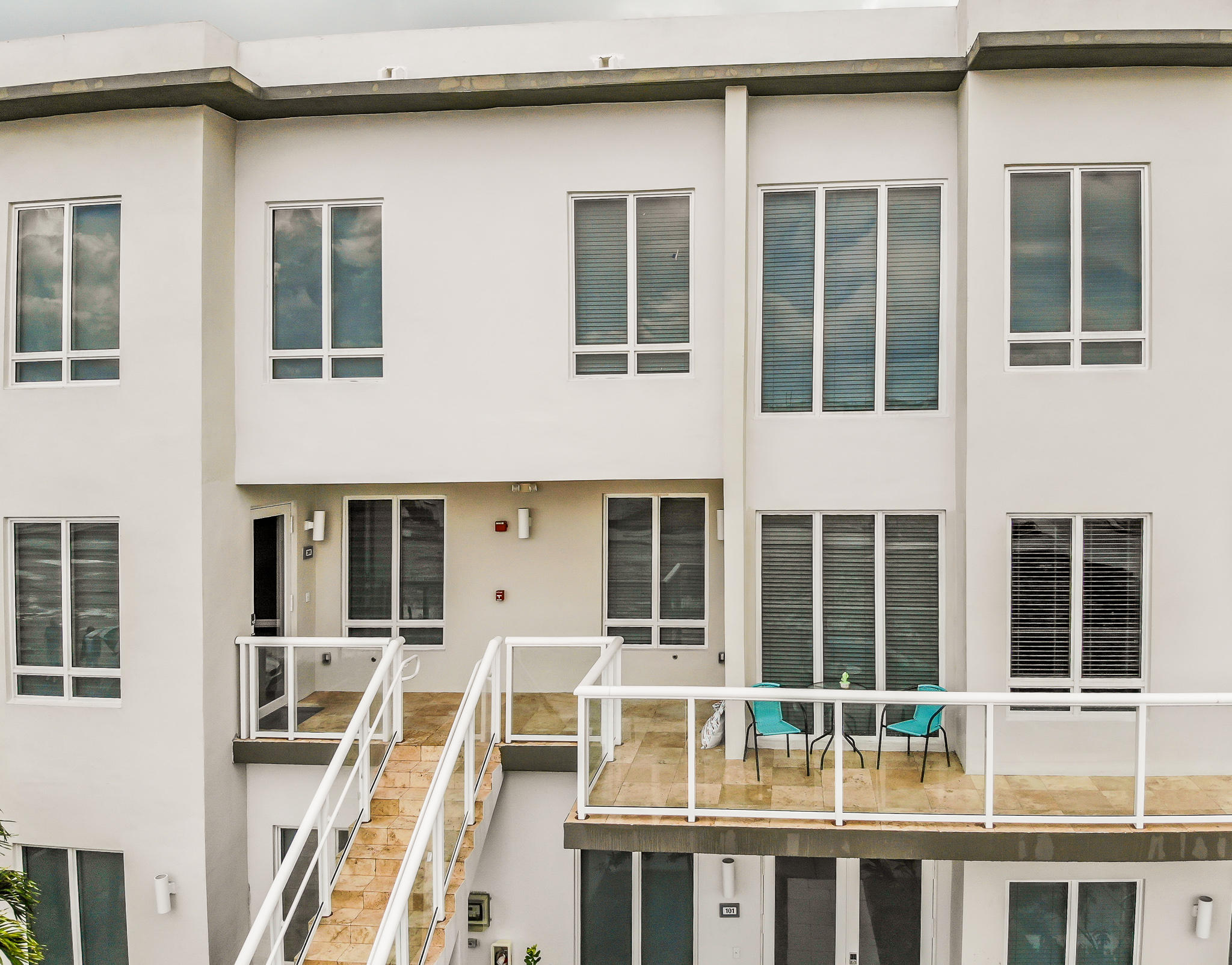 6415 Northwest 102nd Path, Unit 201 Doral, FL 33178 - Photo 40 of 41 a front view of a building with a lot of windows