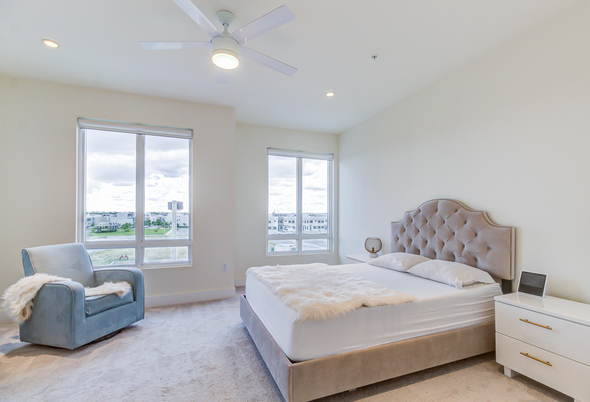 6415 Northwest 102nd Path, Unit 201 Doral, FL 33178 - Photo 4 of 41 a spacious bedroom with a bed and a couch