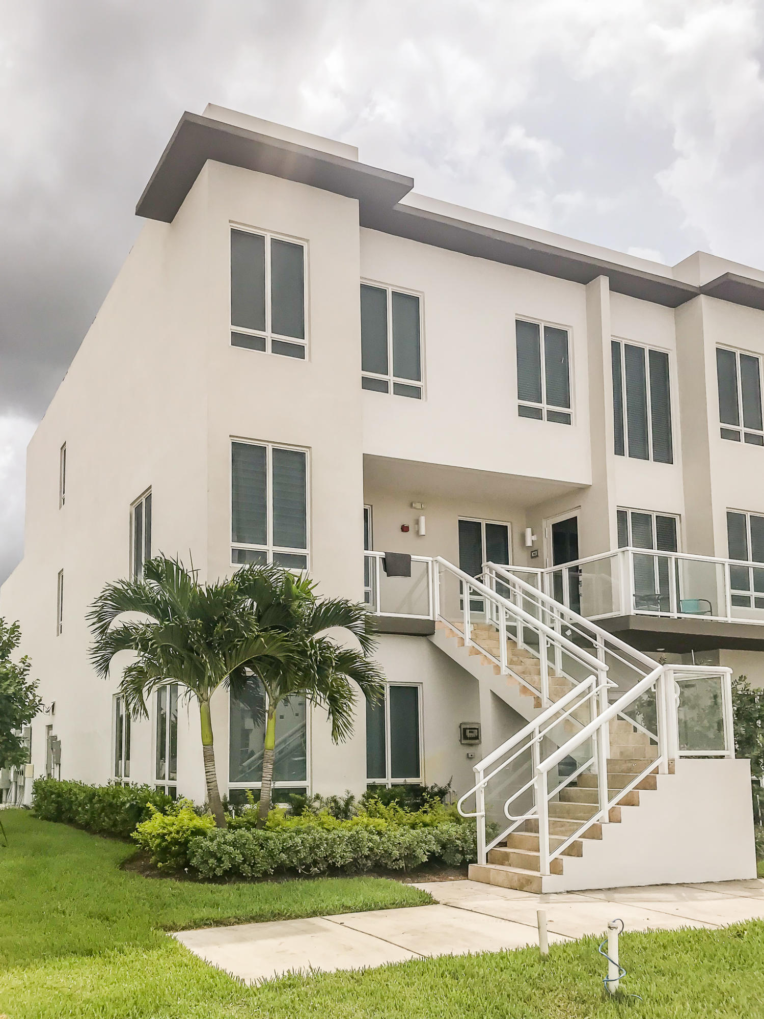 6415 Northwest 102nd Path, Unit 201 Doral, FL 33178 - Photo 41 of 41 a front view of a house with a yard
