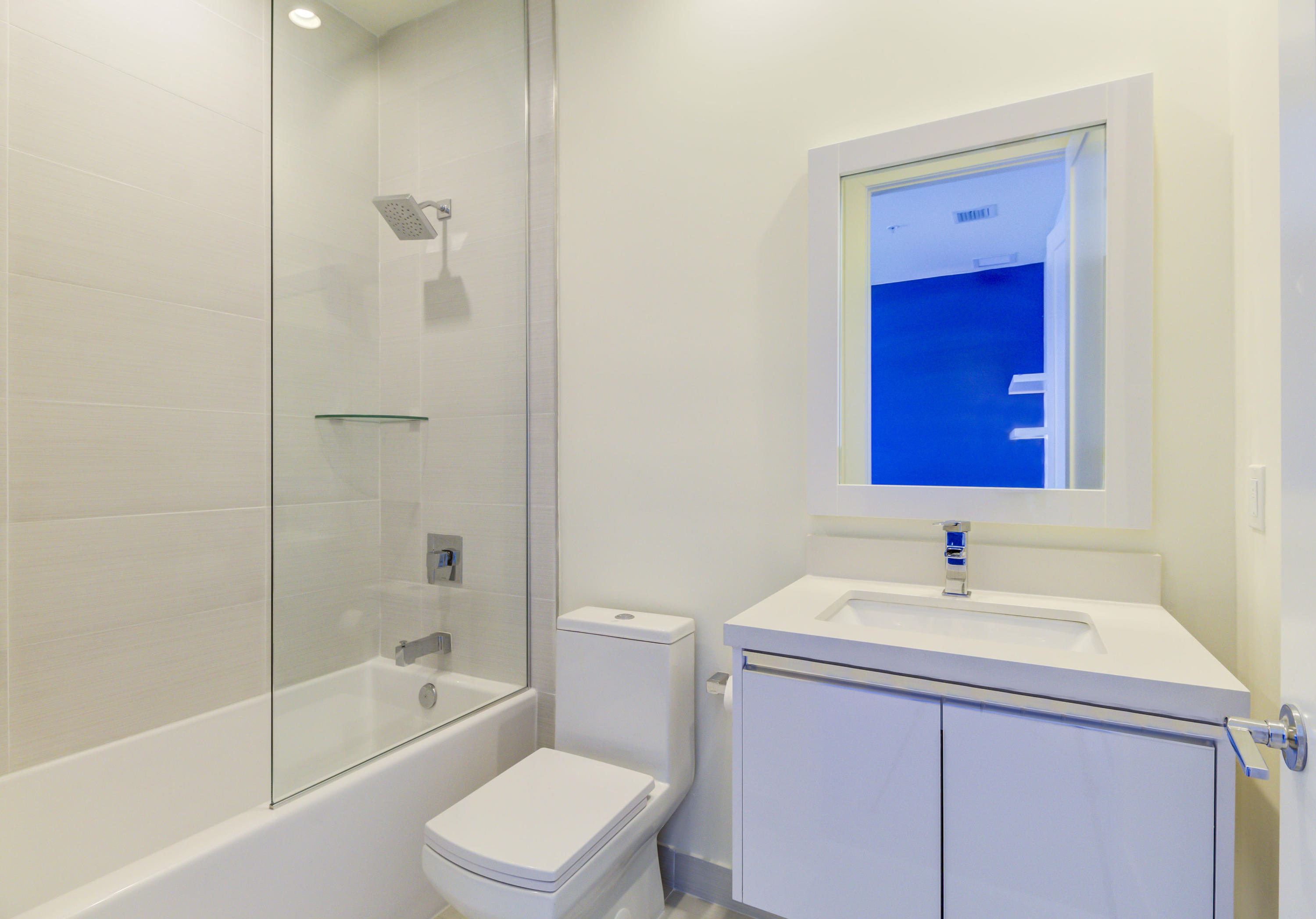 6415 Northwest 102nd Path, Unit 201 Doral, FL 33178 - Photo 6 of 41 a bathroom with a sink a toilet and shower