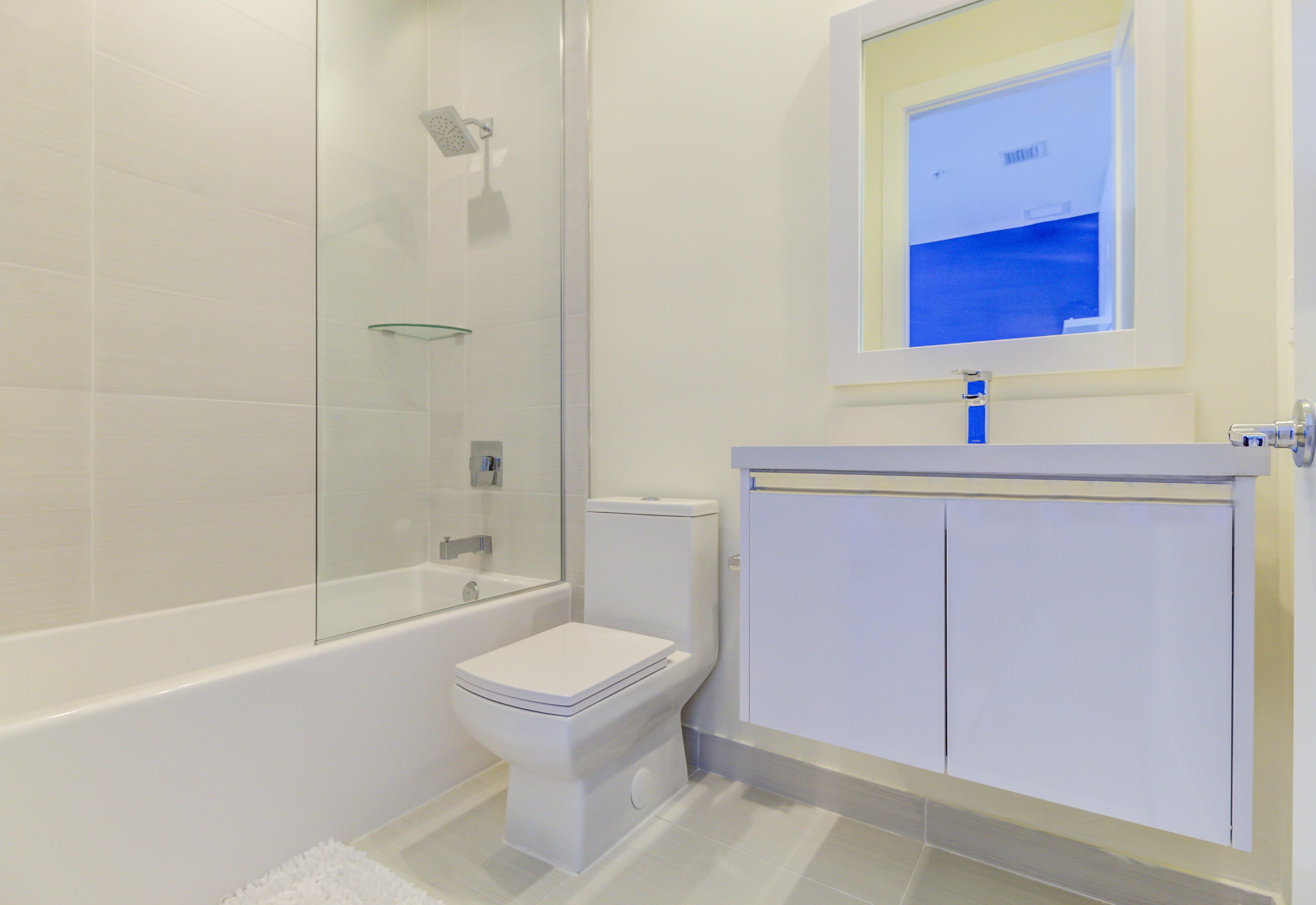 6415 Northwest 102nd Path, Unit 201 Doral, FL 33178 - Photo 7 of 41 a bathroom with a sink toilet and shower