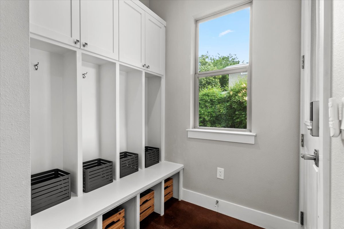 913 Stobaugh Street, Unit B Austin, TX 78757 - Photo 15 of 40 Functional mudroom with custom built-ins provides ample storage for an organized side entry.