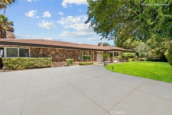 a view of house with yard