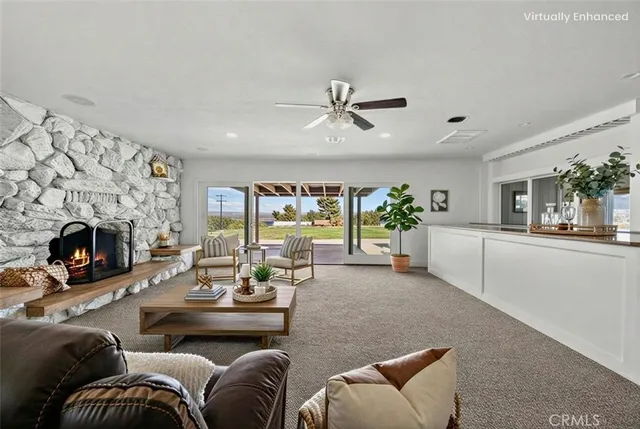 a living room with furniture fireplace and a fireplace