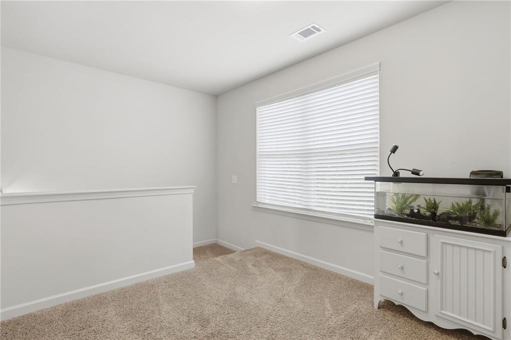 123 Renford Road Ball Ground, GA 30107 - Photo 13 of 27 a view of an empty room with a window