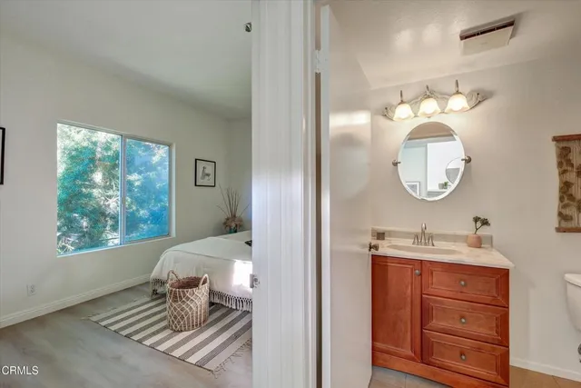 a living room with furniture and a mirror