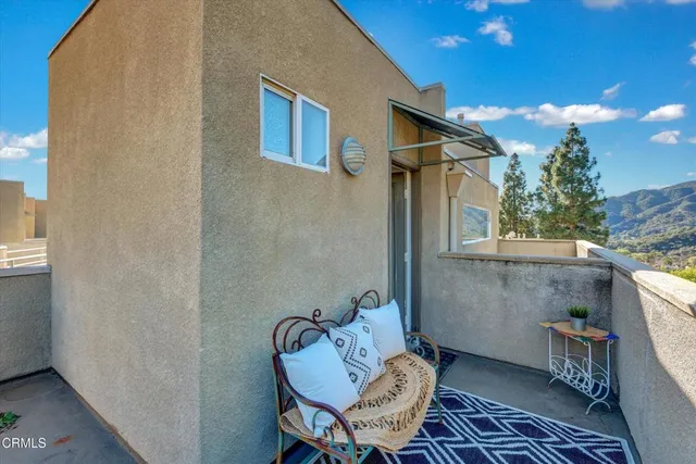 a patio with table and chairs