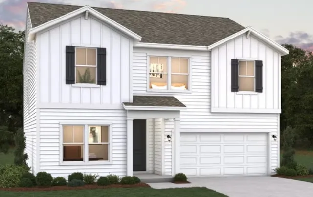 a front view of a house with garage