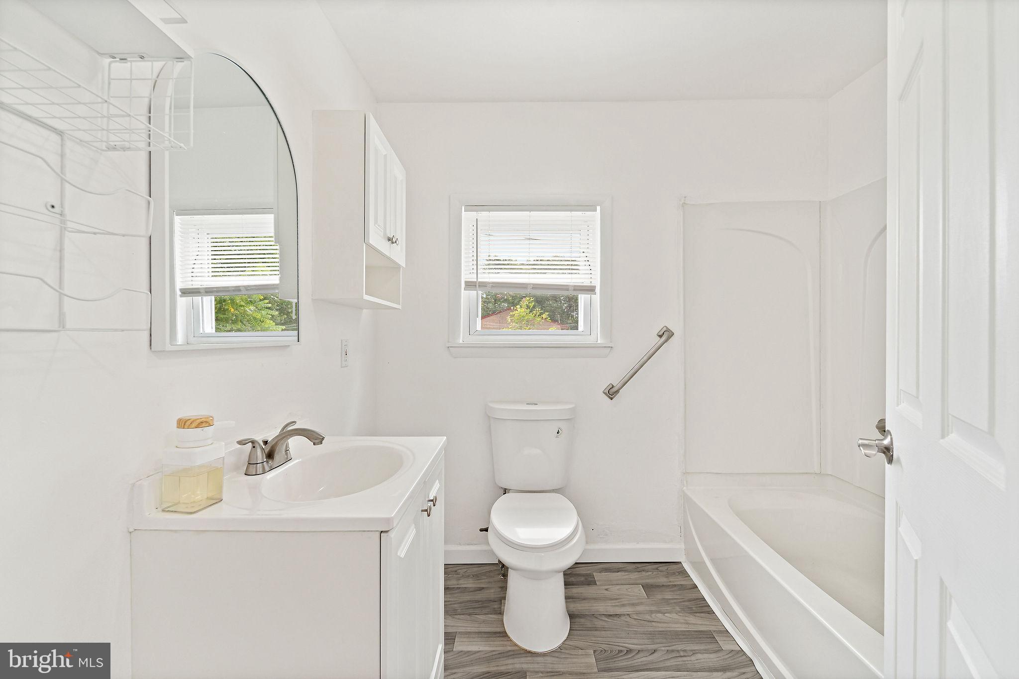 5 Sicklerville Road Sicklerville, NJ 08081 - Photo 11 of 25 a bathroom with a sink a toilet and a bathtub