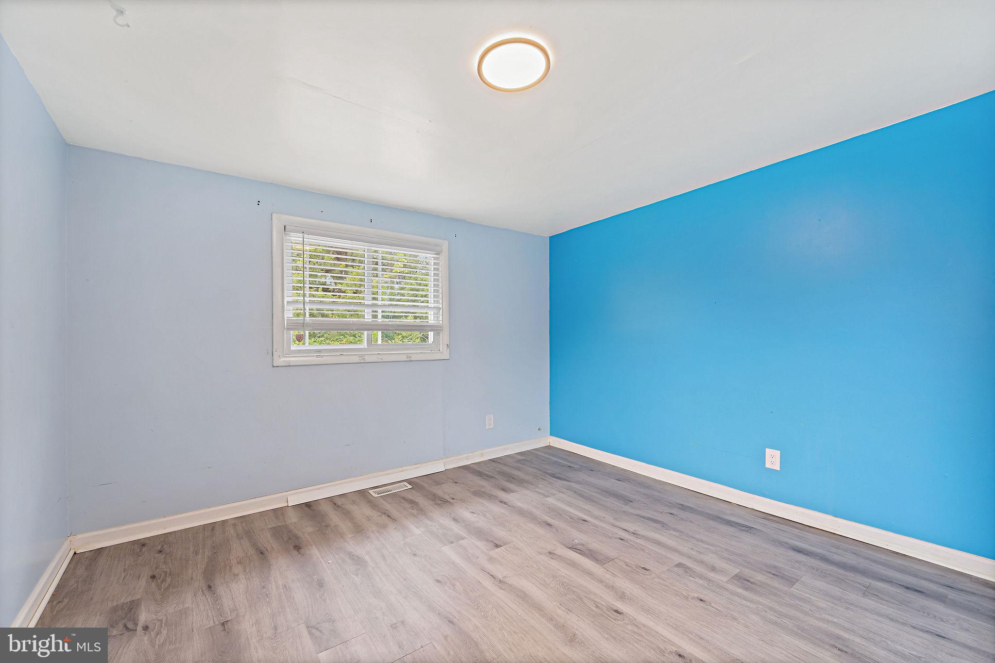 5 Sicklerville Road Sicklerville, NJ 08081 - Photo 16 of 25 an empty room with wooden floor and windows