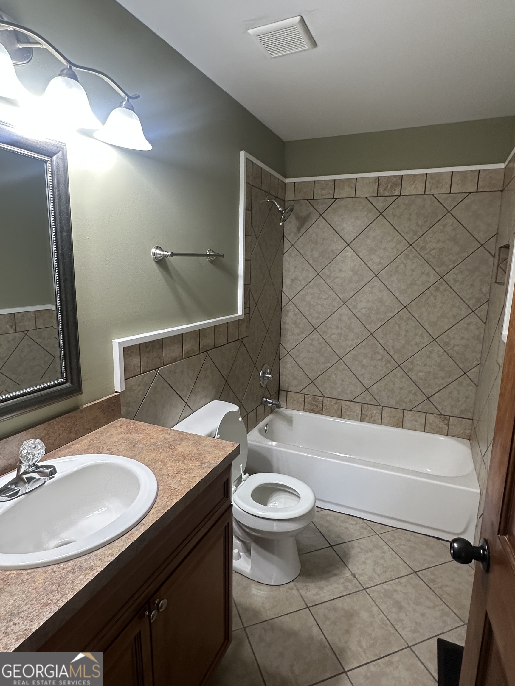 26 Isabelle's Way Colbert, GA 30628 - Photo 17 of 25 a bathroom with a sink a toilet a mirror and bathtub