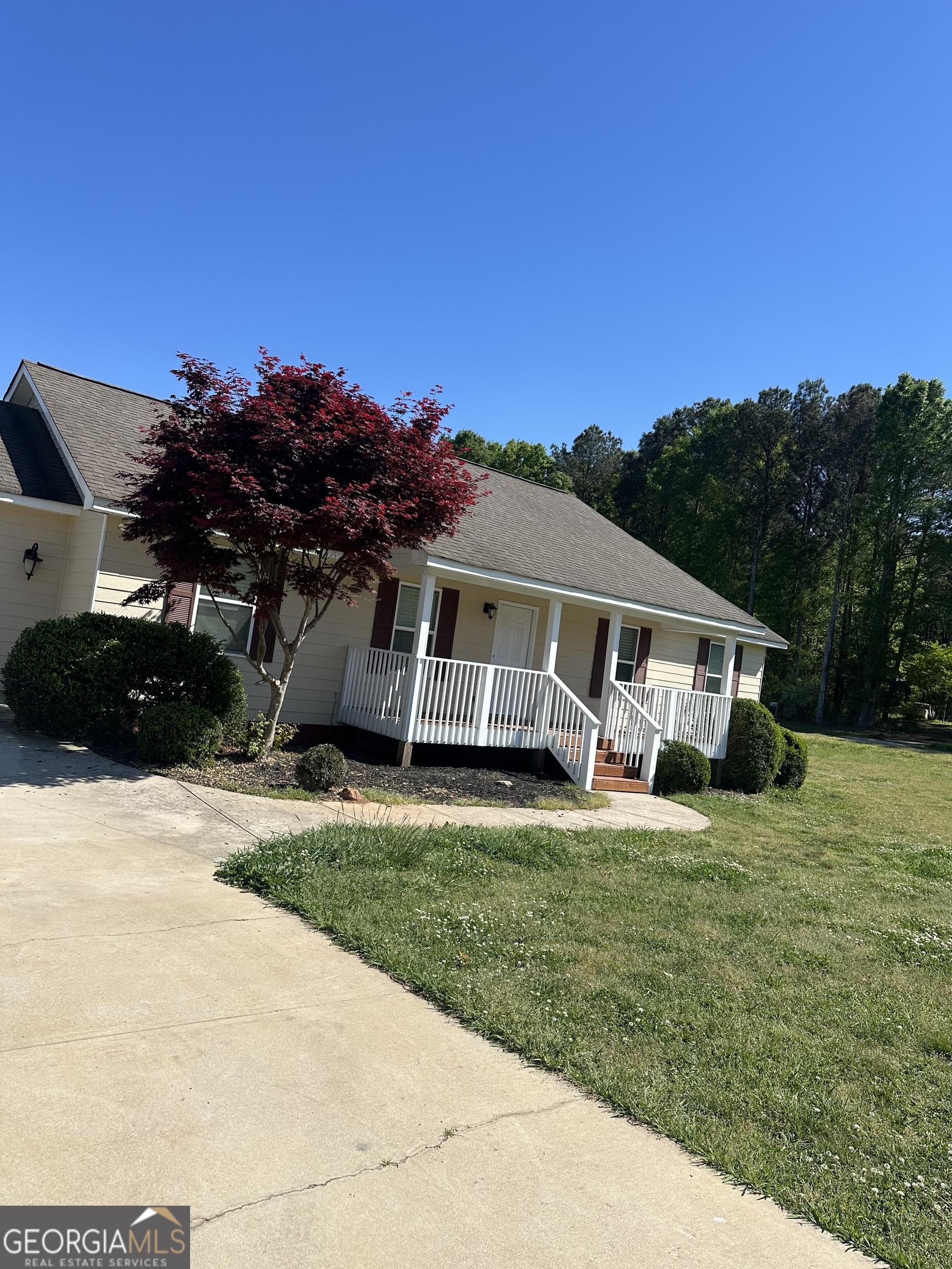 26 Isabelle's Way Colbert, GA 30628 - Photo 24 of 25 a view of a house with a yard