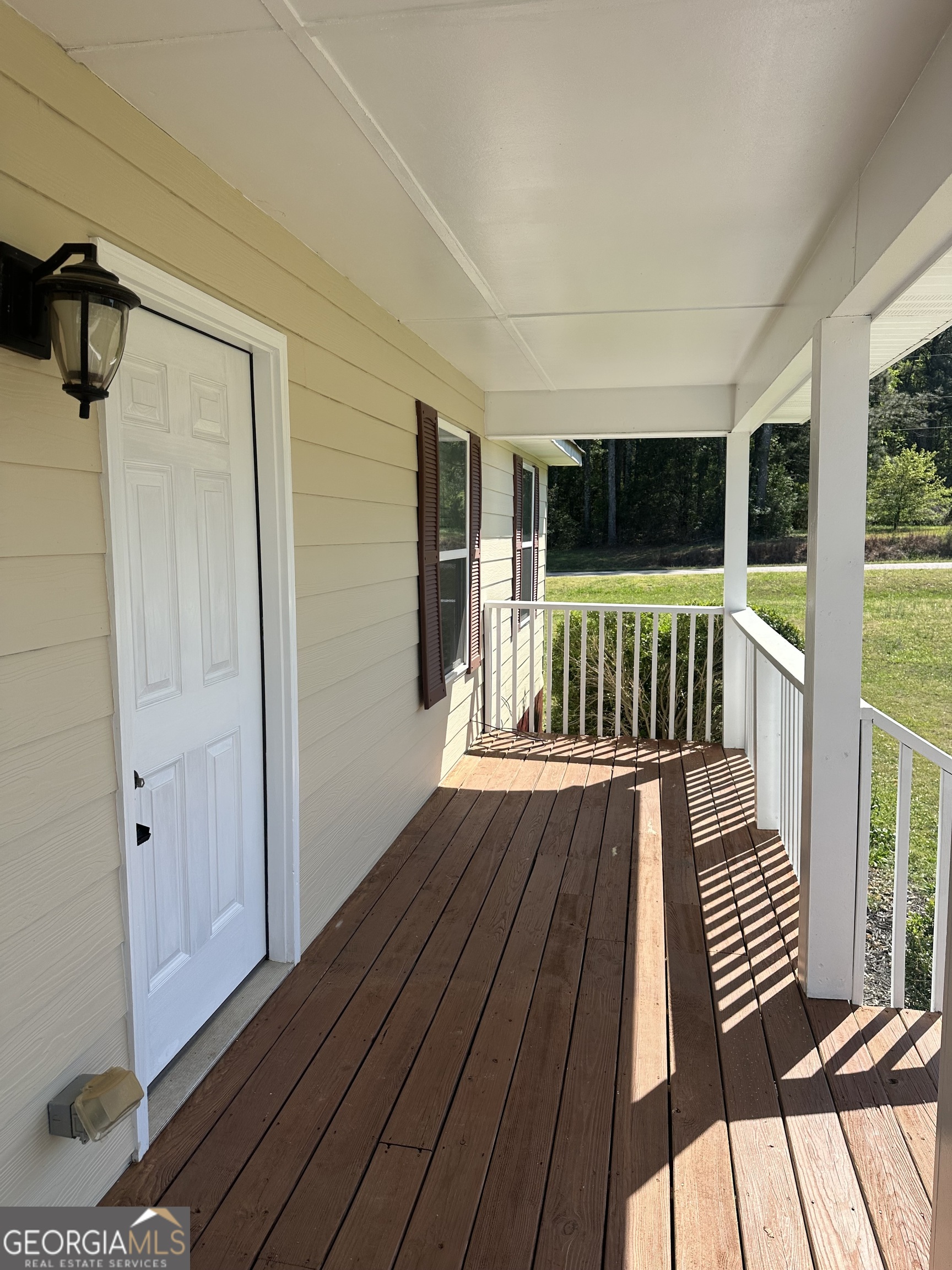 26 Isabelle's Way Colbert, GA 30628 - Photo 8 of 25 a view of balcony with wooden floor