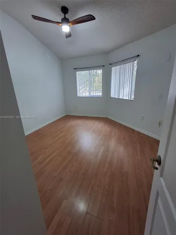 a patio with a yard table and chairs