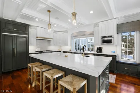 a large kitchen with granite countertop lots of counter top space