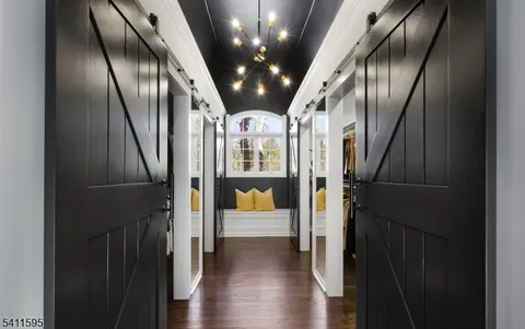 a spacious bathroom with a double vanity sink and a large mirror